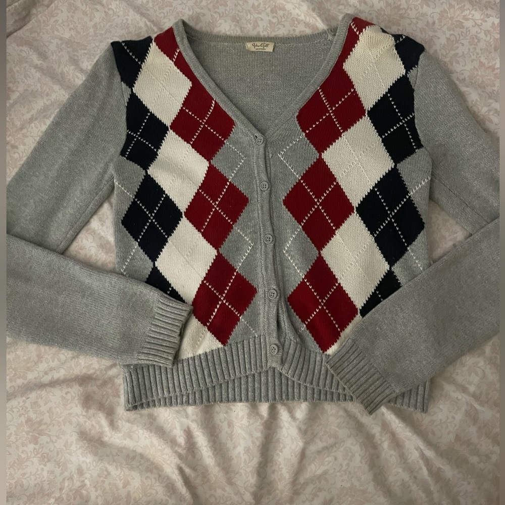 I am selling a checkered cardigan that is grey white and dark blue small
